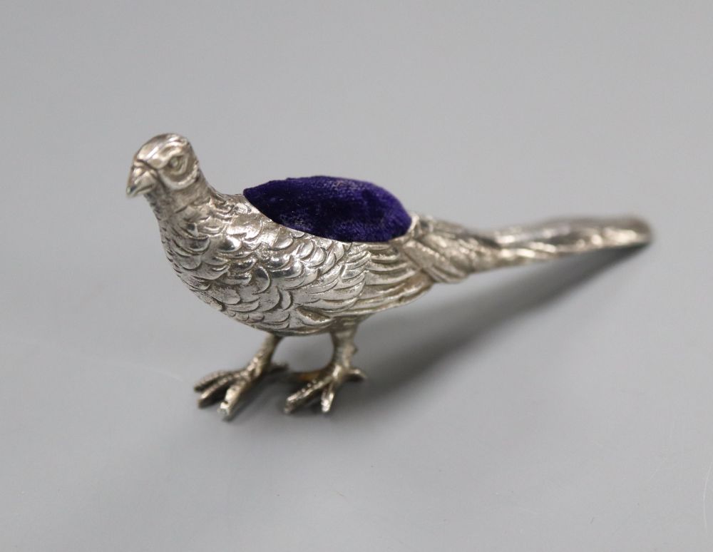 An Edwardian novelty silver pin cushion, modelled as a pheasant, import marks for Glasgow, 1907, 84mm.